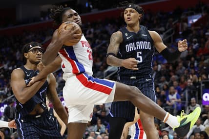 Oct 19, 2022; Detroit, Michigan, USA;  Detroit Pistons center Isaiah Stewart (28) grabs the rebound over center Wendell Carter Jr. (34) and Orlando Magic forward Paolo Banchero (5) in the first half at Little Caesars Arena. Mandatory Credit: Rick Osentoski-USA TODAY Sports