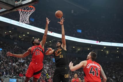 Oct 19, 2022; Toronto, Ontario, CAN; Cleveland Cavaliers center Jarrett Allen (31) drives to the basket as Toronto Raptors forward Thaddeus Young (21) tries to defend during the second quarter at Scotiabank Arena. Mandatory Credit: Nick Turchiaro-USA TODAY Sports