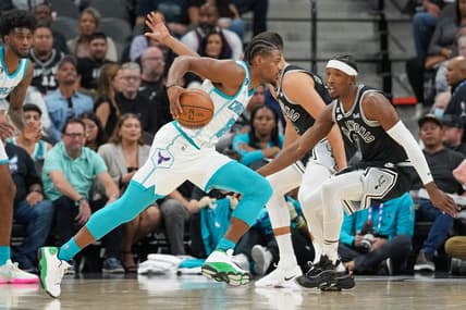 Oct 19, 2022; San Antonio, Texas, USA;  Charlotte Hornets guard Dennis Smith Jr. (8) dribbles in front of San Antonio Spurs guard Josh Richardson (7) in the first half at  the AT&T Center. Mandatory Credit: Daniel Dunn-USA TODAY Sports