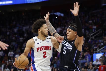 Oct 19, 2022; Detroit, Michigan, USA;  Detroit Pistons guard Cade Cunningham (2) is defended by Orlando Magic forward Paolo Banchero (5) in the second half at Little Caesars Arena. Mandatory Credit: Rick Osentoski-USA TODAY Sports