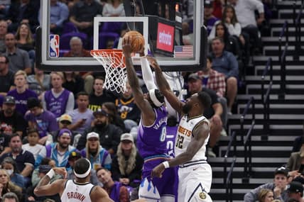 Oct 19, 2022; Salt Lake City, Utah, USA;  Utah Jazz forward Jarred Vanderbilt (8) gets past Denver Nuggets forward Jeff Green (32) and goes to the basket during the second quarter at Vivint Arena. Mandatory Credit: Chris Nicoll-USA TODAY Sports
