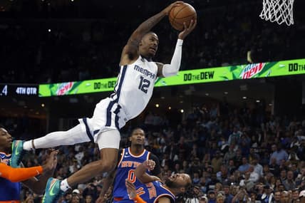 Oct 19, 2022; Memphis, Tennessee, USA; Memphis Grizzlies guard Ja Morant (12) is called for a charge on New York Knicks guard Jalen Brunson (11) with 0.5 second left in regulation at FedExForum. Mandatory Credit: Petre Thomas-USA TODAY Sports