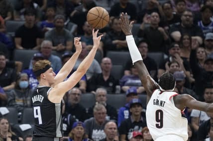 October 19, 2022; Sacramento, California, USA; Sacramento Kings guard Kevin Huerter (9) shoots the basketball against Portland Trail Blazers forward Jerami Grant (9) during the second quarter at Golden 1 Center. Mandatory Credit: Kyle Terada-USA TODAY Sports