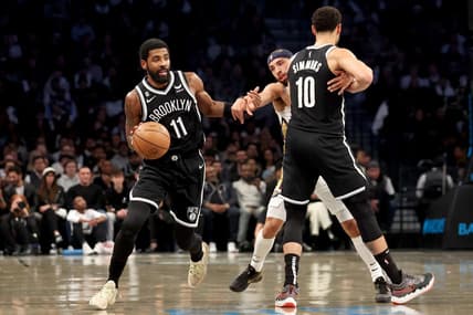 Oct 19, 2022; Brooklyn, New York, USA; Brooklyn Nets guard Ben Simmons (10) sets a pick for guard Kyrie Irving (11) against New Orleans Pelicans guard Jose Alvarado (15) during the first quarter at Barclays Center. Mandatory Credit: Brad Penner-USA TODAY Sports