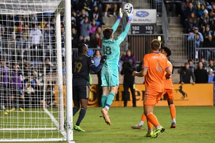Oct 20, 2022; Philadelphia, Pennsylvania, US;  FC Cincinnati goalkeeper Roman Celentano (18) blocks a shot at the goal during the second half against the Philadelphia Union at Subaru Park. Mandatory Credit: Eric Hartline-USA TODAY Sports