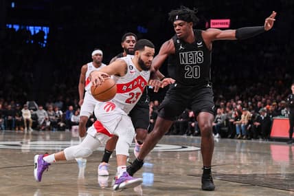 Oct 21, 2022; Brooklyn, New York, USA;  Toronto Raptors guard Fred VanVleet (23) drives to the basket on Brooklyn Nets center Day'Ron Sharpe (20) during the first quarter at Barclays Center. Mandatory Credit: Dennis Schneidler-USA TODAY Sports