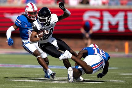 Cincinnati Bearcats wide receiver Jadon Thompson (20) is tackled by Southern Methodist Mustangs safety Ahmaad Moses (16) in the second quarter of the American Athletic Conference game between the Cincinnati Bearcats and the Southern Methodist Mustangs at Gerald J. Ford Stadium in Dallas on Saturday, Oct. 22, 2022.

Cincinnati Bearcats At Southern Methodist Mustangs 463