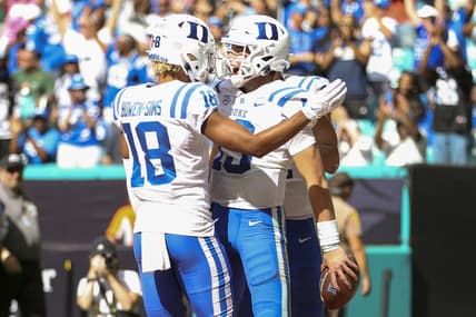 Oct 22, 2022; Miami Gardens, Florida, USA; Duke Blue Devils quarterback Riley Leonard (13) celebrates with wide receiver Malik Bowen-Sims (18) after scoring a touchdown during the fourth quarter against the Miami Hurricanes at Hard Rock Stadium. Mandatory Credit: Sam Navarro-USA TODAY Sports