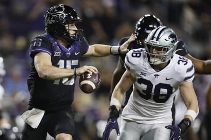 Oct 22, 2022; Fort Worth, Texas, USA; TCU Horned Frogs quarterback Max Duggan (15) scrambles abasing Kansas State Wildcats defensive end Brendan Mott (38) in the first quarter at Amon G. Carter Stadium. Mandatory Credit: Tim Heitman-USA TODAY Sports