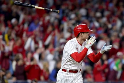 Oct 22, 2022; Philadelphia, Pennsylvania, USA; Philadelphia Phillies first baseman Rhys Hoskins (17) flips his bat after hitting a two-run home run in the fifth inning during game four of the NLCS against the San Diego Padres for the 2022 MLB Playoffs at Citizens Bank Park. Mandatory Credit: Bill Streicher-USA TODAY Sports