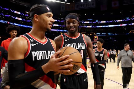 Oct 23, 2022; Los Angeles, California, USA;  Portland Trail Blazers guard Josh Hart (11) and forward Jerami Grant (9) celebrate a victory against the Los Angeles Lakers at Crypto.com Arena. Mandatory Credit: Kiyoshi Mio-USA TODAY Sports
