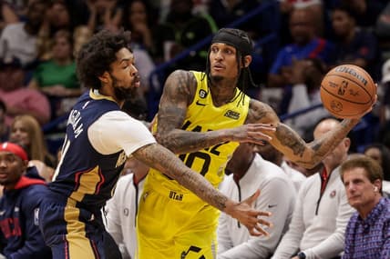 Oct 23, 2022; New Orleans, Louisiana, USA;  Utah Jazz guard Jordan Clarkson (00) looks to pass the ball against New Orleans Pelicans forward Brandon Ingram (14) during the first half at Smoothie King Center. Mandatory Credit: Stephen Lew-USA TODAY Sports