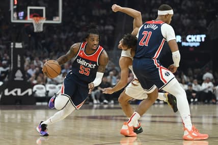 Oct 23, 2022; Cleveland, Ohio, USA; Washington Wizards guard Delon Wright (55) drives to the basket against as center Daniel Gafford (21) picks Cleveland Cavaliers guard Raul Neto (19) during the first half at Rocket Mortgage FieldHouse. Mandatory Credit: Ken Blaze-USA TODAY Sports