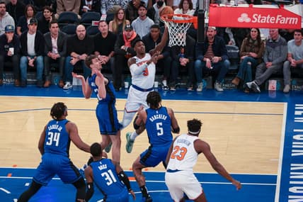 Oct 24, 2022; New York, New York, USA; New York Knicks guard RJ Barrett (9) drives to the basket as Orlando Magic forward Paolo Banchero (5) and forward Franz Wagner (22) defend at Madison Square Garden. Mandatory Credit: Vincent Carchietta-USA TODAY Sports