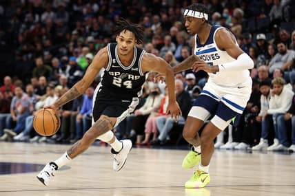Oct 24, 2022; Minneapolis, Minnesota, USA; San Antonio Spurs guard Devin Vassell (24) dribbles the ball while Minnesota Timberwolves forward Jaden McDaniels (3) defends during the first quarter at Target Center. Mandatory Credit: Matt Krohn-USA TODAY Sports
