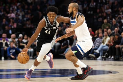Oct 24, 2022; Minneapolis, Minnesota, USA; San Antonio Spurs guard Joshua Primo (11) dribbles while Minnesota Timberwolves guard Jordan McLaughlin (6) defends during the first quarter at Target Center. Mandatory Credit: Matt Krohn-USA TODAY Sports