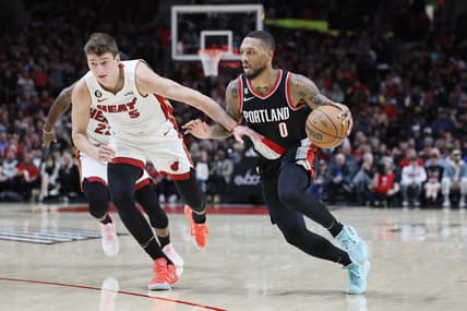 Oct 26, 2022; Portland, Oregon, USA; Portland Trail Blazers point guard Damian Lillard (0) dribbles the ball against  Miami Heat forward Nikola Jovic (5) during the first half at Moda Center. Mandatory Credit: Soobum Im-USA TODAY Sports