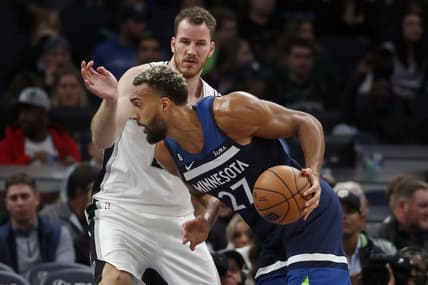Oct 26, 2022; Minneapolis, Minnesota, USA; Minnesota Timberwolves center Rudy Gobert (27) works past San Antonio Spurs center Jakob Poeltl (25) in the second quarter at Target Center. Mandatory Credit: Bruce Kluckhohn-USA TODAY Sports