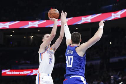 Oct 27, 2022; Oklahoma City, Oklahoma, USA; Oklahoma City Thunder forward Aleksej Pokusevski (17) shoots as LA Clippers center Ivica Zubac (40) defends the shot during the first half at Paycom Center. Mandatory Credit: Alonzo Adams-USA TODAY Sports