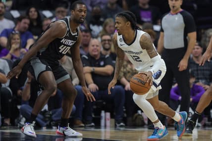 Oct 27, 2022; Sacramento, California, USA; Memphis Grizzlies guard Ja Morant (12) dribbles the ball against Sacramento Kings forward Harrison Barnes (40) during the first quarter at Golden 1 Center. Mandatory Credit: Sergio Estrada-USA TODAY Sports