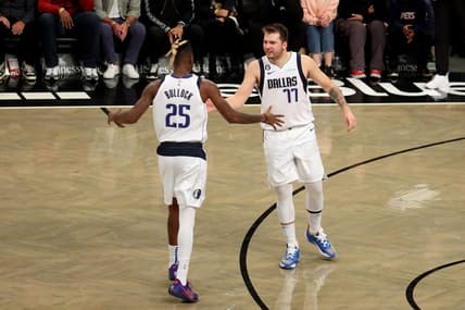 Oct 27, 2022; Brooklyn, New York, USA; Dallas Mavericks guard Luka Doncic (77) celebrates with forward Reggie Bullock (25) during overtime against the Brooklyn Nets at Barclays Center. Mandatory Credit: Brad Penner-USA TODAY Sports