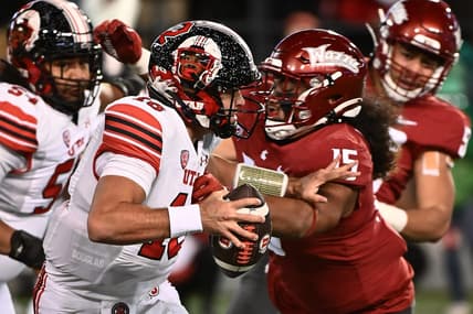 Oct 27, 2022; Pullman, Washington, USA; Utah Utes quarterback Bryson Barnes (16) breaks away from Washington State Cougars defensive lineman Nusi Malani (15) in the first half at Gesa Field at Martin Stadium. Mandatory Credit: James Snook-USA TODAY Sports