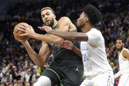 Oct 28, 2022; Minneapolis, Minnesota, USA; Minnesota Timberwolves center Rudy Gobert (27) works against Los Angeles Lakers center Damian Jones (30) in the first quarter at Target Center. Mandatory Credit: Bruce Kluckhohn-USA TODAY Sports