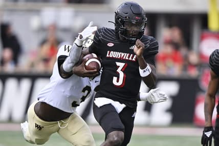 Oct 29, 2022; Louisville, Kentucky, USA;  Louisville Cardinals quarterback Malik Cunningham (3) runs the ball against Wake Forest Demon Deacons defensive back Malik Mustapha (3) during the first quarter at Cardinal Stadium. Mandatory Credit: Jamie Rhodes-USA TODAY Sports