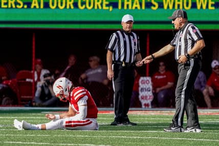 Oct 29, 2022; Lincoln, Nebraska, USA; Nebraska Cornhuskers quarterback Casey Thompson (11) sits on the ground while awaiting medical staff for an injury during the second quarter against the Illinois Fighting Illini at Memorial Stadium. Mandatory Credit: Dylan Widger-USA TODAY Sports