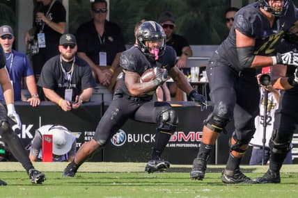 Oct 29, 2022; Orlando, Florida, USA; UCF Knights running back RJ Harvey (22) carries the ball during the second quarter against the Cincinnati Bearcats at FBC Mortgage Stadium. Mandatory Credit: Mike Watters-USA TODAY Sports