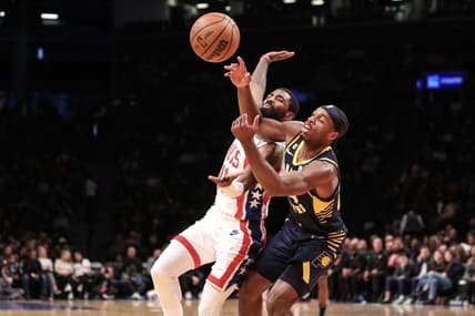 Oct 29, 2022; Brooklyn, New York, USA;  Brooklyn Nets guard Kyrie Irving (11) and Indiana Pacers guard Buddy Hield (24) fight for a loose ball in the second quarter at Barclays Center. Mandatory Credit: Wendell Cruz-USA TODAY Sports
