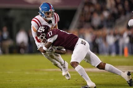 Oct 29, 2022; College Station, Texas, USA;  Texas A&M Aggies defensive back Jaylon Jones (17) tackles Mississippi Rebels quarterback Jaxson Dart (2) in the first half at Kyle Field. Mandatory Credit: Daniel Dunn-USA TODAY Sports