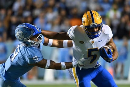 Oct 29, 2022; Chapel Hill, North Carolina, USA; Pittsburgh Panthers wide receiver Jared Wayne (5) with the ball as North Carolina Tar Heels defensive back Cam'Ron Kelly (9) defends in the second quarter at Kenan Memorial Stadium. Mandatory Credit: Bob Donnan-USA TODAY Sports