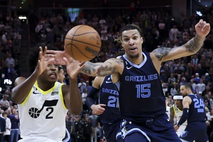 Oct 29, 2022; Salt Lake City, Utah, USA; Utah Jazz guard Collin Sexton (2) and Memphis Grizzlies forward Brandon Clarke (15) battle for a loose ball in the fourth quarter at Vivint Arena. Mandatory Credit: Rob Gray-USA TODAY Sports