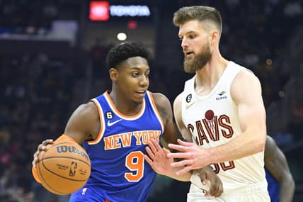 Oct 30, 2022; Cleveland, Ohio, USA; Cleveland Cavaliers forward Dean Wade (32) defends New York Knicks guard RJ Barrett (9) in the second quarter at Rocket Mortgage FieldHouse. Mandatory Credit: David Richard-USA TODAY Sports