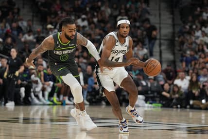 Oct 30, 2022; San Antonio, Texas, USA;  San Antonio Spurs guard Blake Wesley (14) dribbles against Minnesota Timberwolves guard D'Angelo Russell (0) in the first half at the AT&T Center. Mandatory Credit: Daniel Dunn-USA TODAY Sports