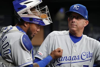 Apr 22, 2019; St. Petersburg, FL, USA; Kansas City Royals  catching coach Pedro Grifol (7) talks with catcher Martin Maldonado (16) at Tropicana Field. Mandatory Credit: Kim Klement-USA TODAY Sports
