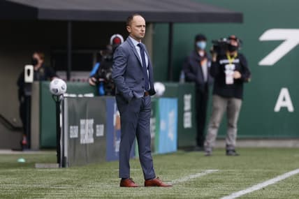 Nov 14, 2021; Portland, OR, USA; Portland Thorns head coach Mark Parsons watches his team from the sideline Chicago Red Stars during the first half of the NWSL semi final at Providence Park. Mandatory Credit: Soobum Im-USA TODAY Sports