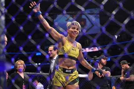 Jul 16, 2022; Elmont, New York, USA; Amanda Lemos (blue gloves) reacts to fight against Michelle Waterson-Gomez (red gloves) during UFC Fight Night at UBS Arena. Mandatory Credit: Ed Mulholland-USA TODAY Sports