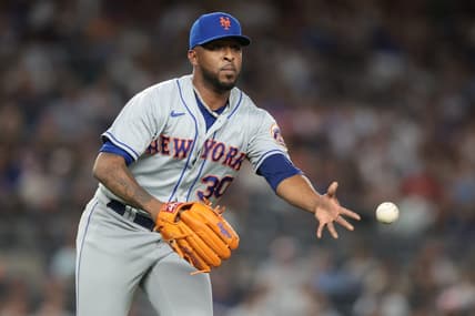 Aug 23, 2022; Bronx, New York, USA; New York Mets relief pitcher Joely Rodriguez (30) tosses the ball to first base for an out during the seventh inning against the New York Yankees at Yankee Stadium. Mandatory Credit: Vincent Carchietta-USA TODAY Sports