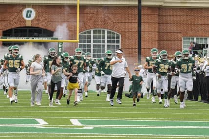 Sep 10, 2022; Charlotte, North Carolina, USA; Charlotte 49ers head coach Will Healy and friends take the field during the first quarter against the Maryland Terrapins at Jerry Richardson Stadium. Mandatory Credit: Jim Dedmon-USA TODAY Sports