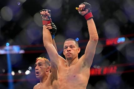 Sep 10, 2022; Las Vegas, Nevada, USA; Nate Diaz (red gloves) fights Tony Ferguson (blue gloves) during UFC 279 at T-Mobile Arena. Mandatory Credit: Joe Camporeale-USA TODAY Sports