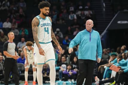 Oct 10, 2022; Charlotte, North Carolina, USA; Charlotte Hornets head coach Steve Clifford fist bumps center Nick Richards (4) after his fourth foul during the second half against the Washington Wizards at Spectrum Center. Mandatory Credit: Jim Dedmon-USA TODAY Sports