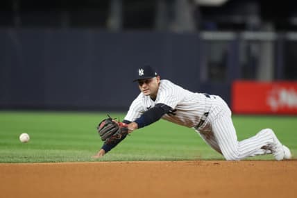 Oct 23, 2022; Bronx, New York, USA; New York Yankees shortstop Isiah Kiner-Falefa (12) dives for the ball in the first inning against the Houston Astros during game four of the ALCS for the 2022 MLB Playoffs at Yankee Stadium. Mandatory Credit: Wendell Cruz-USA TODAY Sports