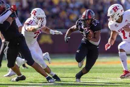 Oct 29, 2022; Minneapolis, Minnesota, USA; Minnesota Golden Gophers running back Mohamed Ibrahim (24) evades Rutgers Scarlet Knights defensive lineman Aaron Lewis (71) in the first quarter at Huntington Bank Stadium. Mandatory Credit: Matt Blewett-USA TODAY Sports