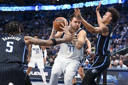 Oct 30, 2022; Dallas, Texas, USA; Orlando Magic guard R.J. Hampton (13) and forward Paolo Banchero (5) defend against Dallas Mavericks guard Luka Doncic (77) during the second half at the American Airlines Center. Mandatory Credit: Jerome Miron-USA TODAY Sports