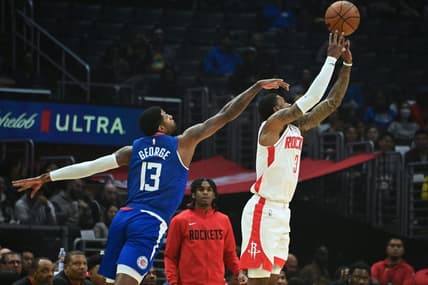 Oct 31, 2022; Los Angeles, California, USA; Houston Rockets guard Kevin Porter Jr. (3) shoots the ball defended by LA Clippers guard Paul George (13) in the first half  at Crypto.com Arena. Mandatory Credit: Richard Mackson-USA TODAY Sports