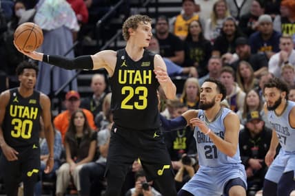 Oct 31, 2022; Salt Lake City, Utah, USA; Utah Jazz forward Lauri Markkanen (23) keeps the ball away from Memphis Grizzlies guard Tyus Jones (21) during the second half at Vivint Arena. Mandatory Credit: Chris Nicoll-USA TODAY Sports