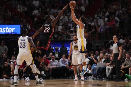 Nov 1, 2022; Miami, Florida, USA; Golden State Warriors guard Stephen Curry (30) attempts a three point shot over Miami Heat forward Jimmy Butler (22) during the second half at FTX Arena. Mandatory Credit: Jasen Vinlove-USA TODAY Sports