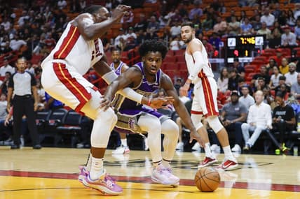 Nov 2, 2022; Miami, Florida, USA; Sacramento Kings guard Davion Mitchell (15) dribbles as Miami Heat center Bam Adebayo (13) defends during the first quarter at FTX Arena. Mandatory Credit: Sam Navarro-USA TODAY Sports